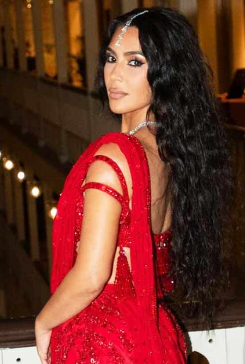 A person in a red dress

Description automatically generated