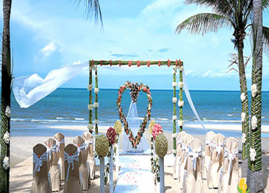 A wedding ceremony on a beach

Description automatically generated