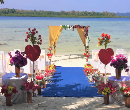 A wedding ceremony on a beach

Description automatically generated