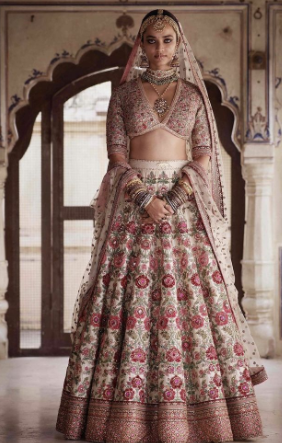 A person in a traditional indian dress
Description automatically generated