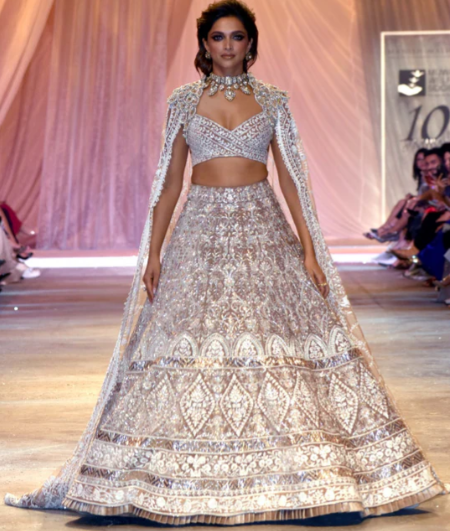 A person in a dress
Description automatically generated