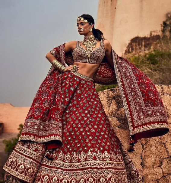 A person in a red dress
Description automatically generated