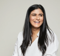 A person with long black hair
Description automatically generated