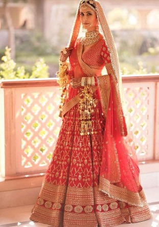 A person in a red dress
Description automatically generated